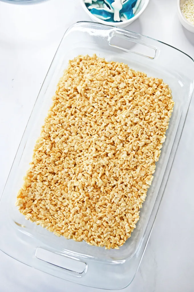 rice krispie mixture pressed into a 9x13 glass dish