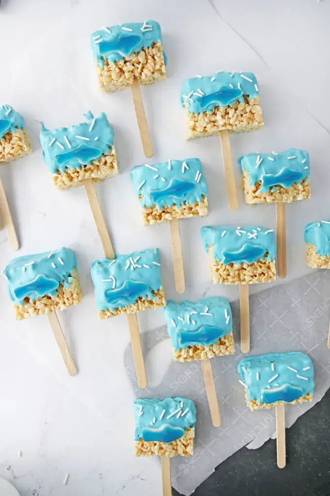 dipped rice krispie treats on parchment paper